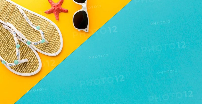 Top view summer slippers with sunglasses