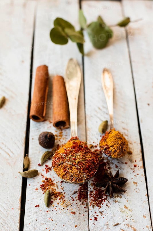 Cinnamon sticks spoon with indian spices