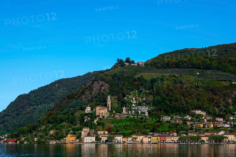 Beautiful Village Morcote witha Chucrh and Castle on Lake Lugano and Mountainscape with blue Clear sky in Morcote