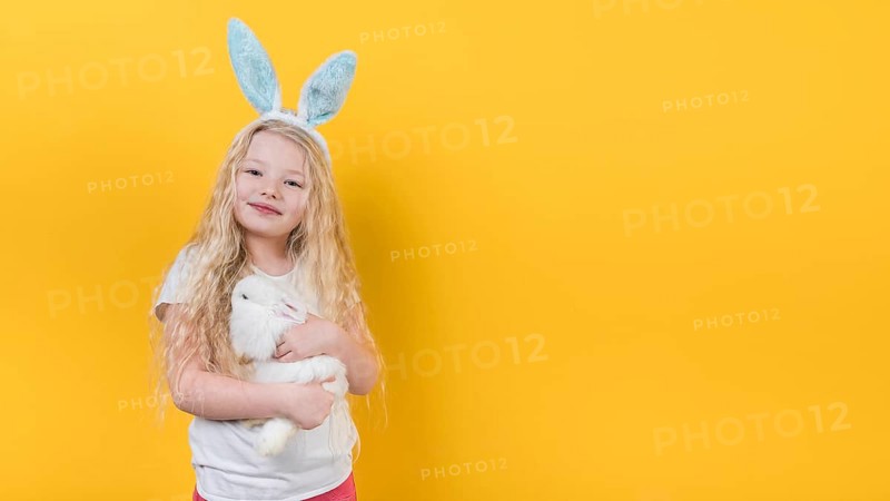 Blond girl bunny ears with rabbit