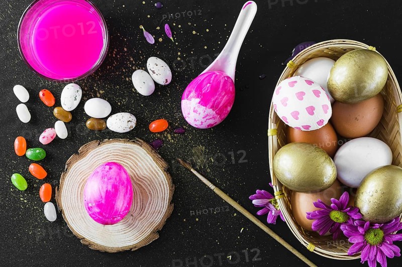 Jelly beans near paint eggs