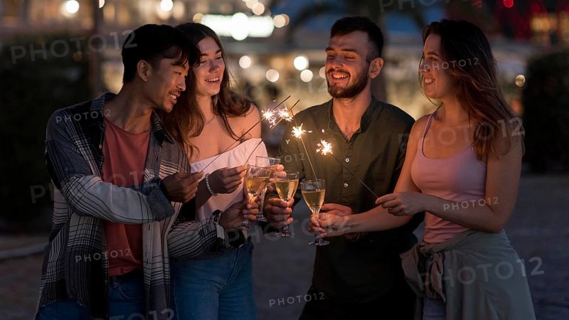 Medium shot friends with fireworks night