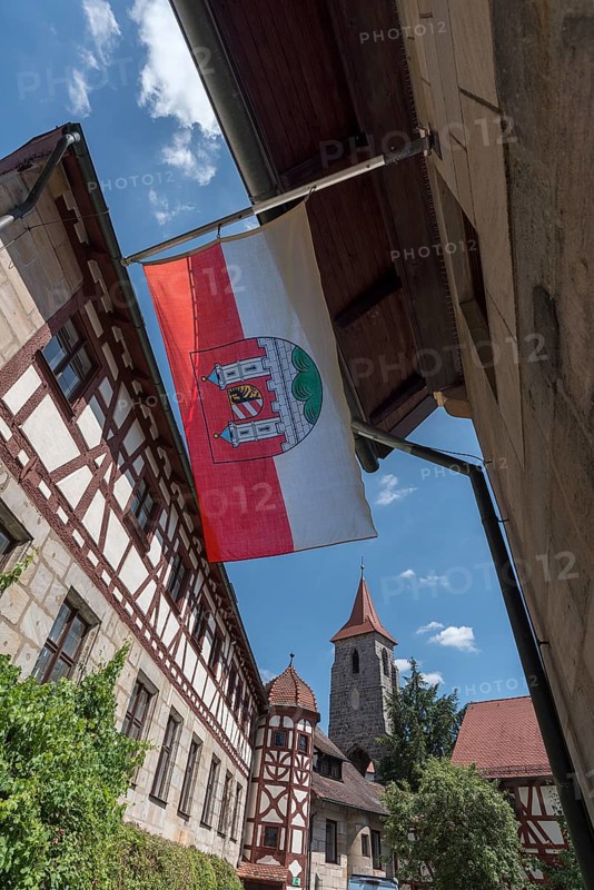 Waving Lauf town flag in the former Glockengiesser Spital