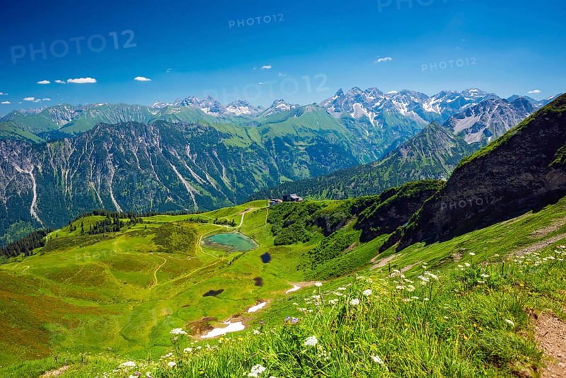 Panorama from the Fellhorn over the Schlappoldsee and Fellhornbahn mountain station to the central main ridge of the Allgaeu Alps