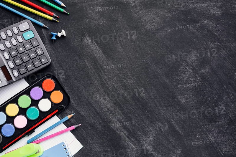 Colourful paints calculator pencils grey background