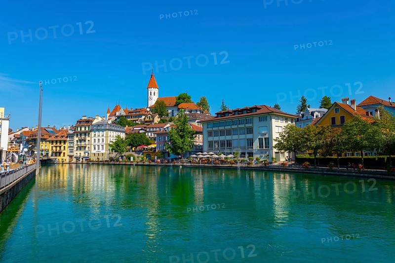 City of Thun and River Aare with Castle and Church in a Sunny Day in Bernese Oberland