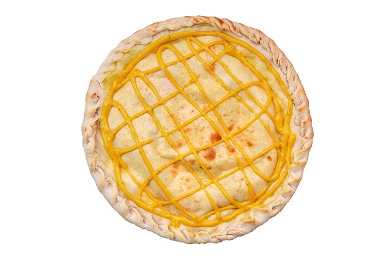 Top view of round closed pizza with chicken and mustard sauce isolated on white