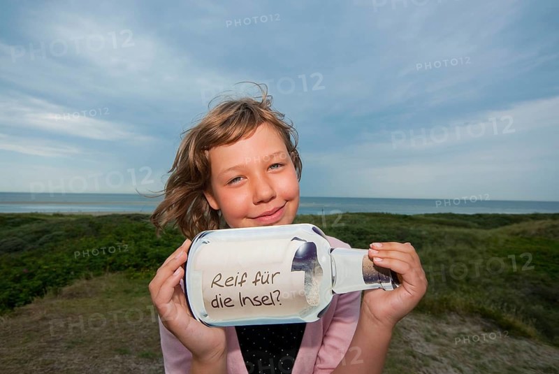 Child with message in a bottle