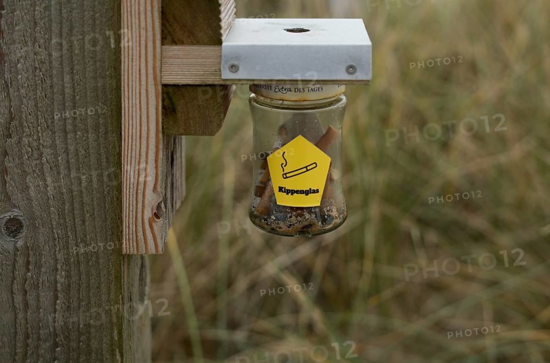 Jam jar serves as an ashtray for butts