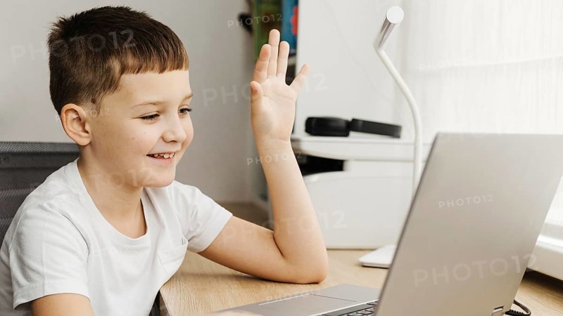 Boy attending online course