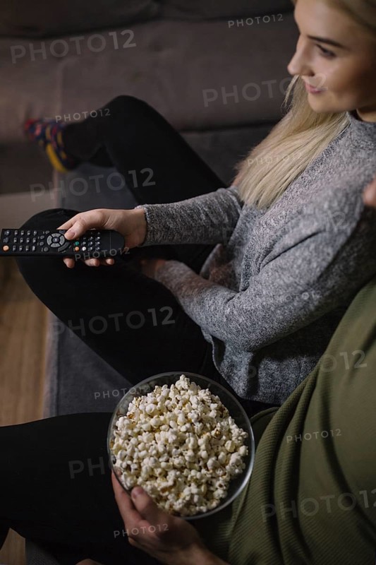 Crop couple watching tv sofa