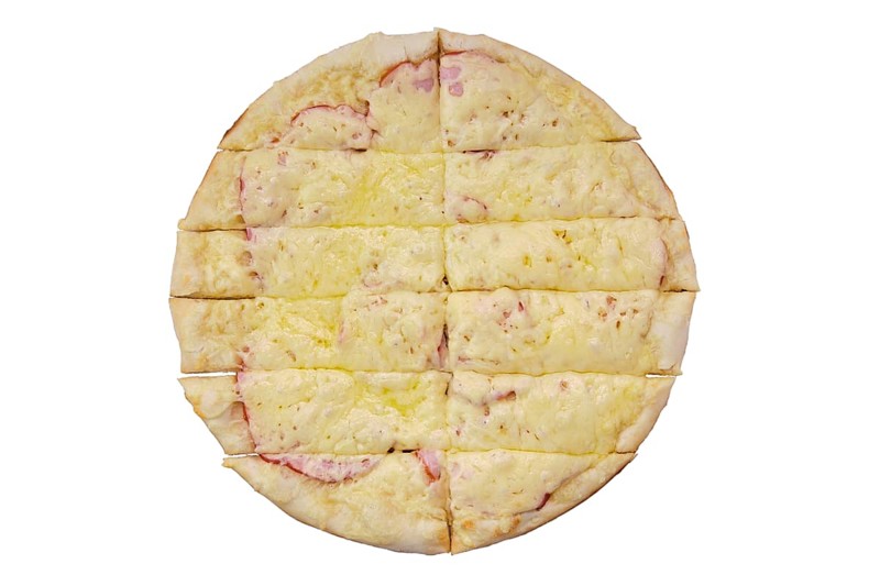 Top view of focaccia with ham and pickled cucumber cut on stripes