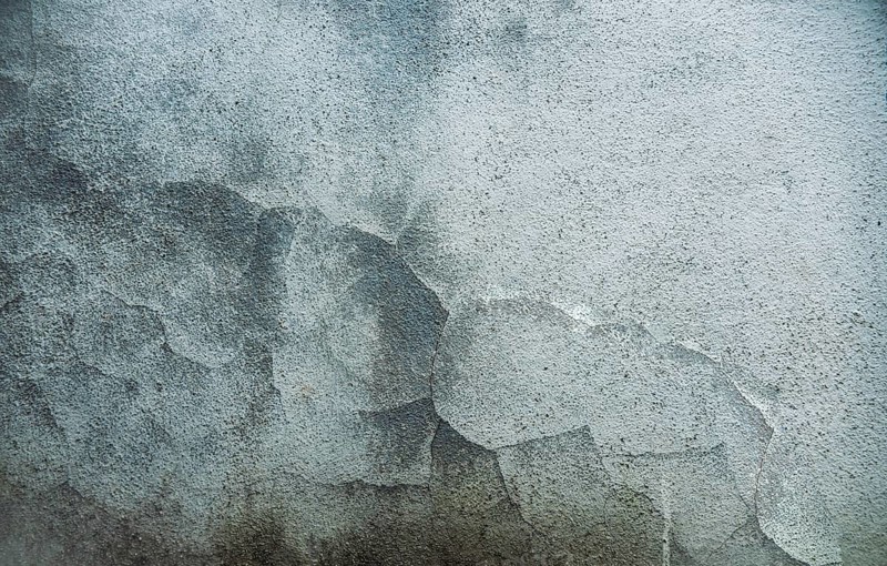 Textured old wall background. Texture of a gray wall. Old wall with cracked texture. Cracked cement wall background. Textured and cracked wall