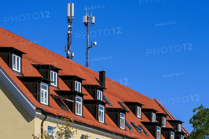 Rores tiled roof with dormers and antennas