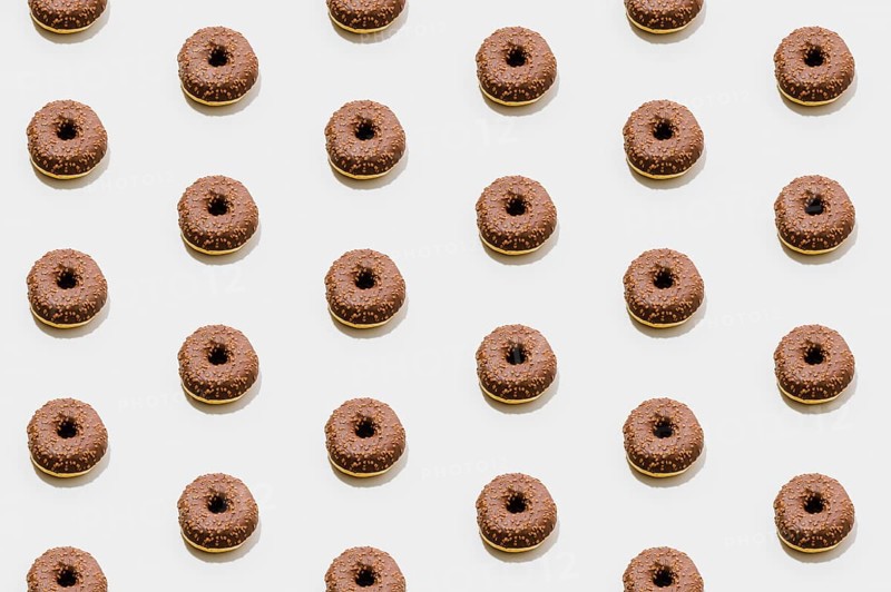 Bakery pattern with chocolate donuts