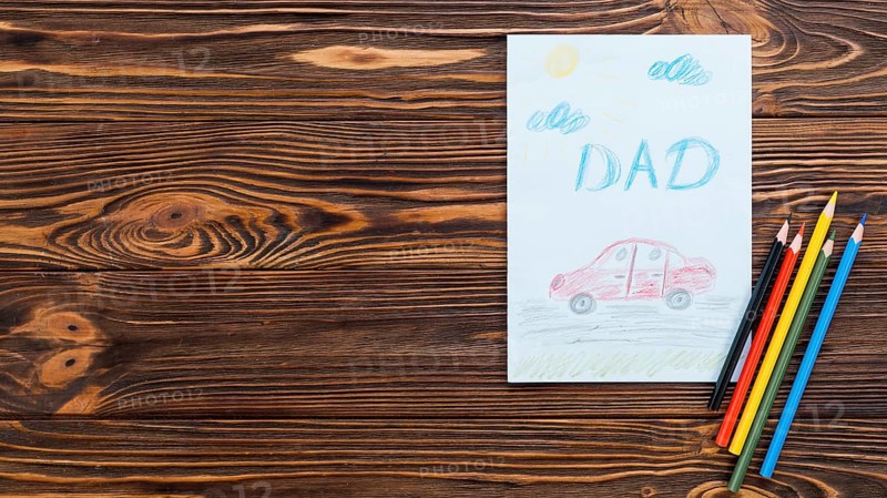 Dad inscription with car drawing paper sheet