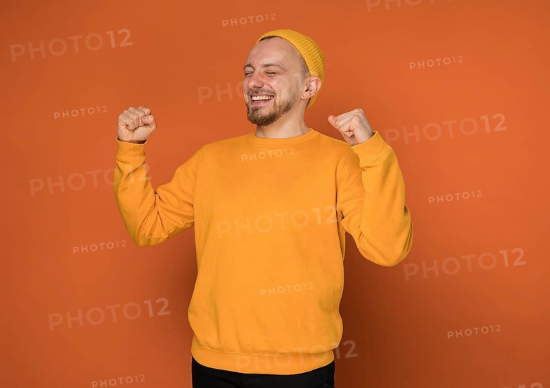 Happy young man laughing indoors 5