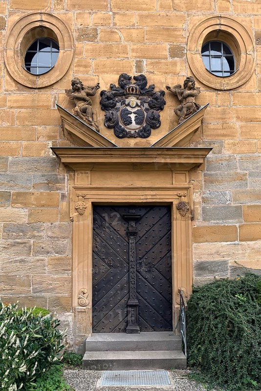 Entrance portal of St Luke's Church with the coat of arms of the von Egloffstein family