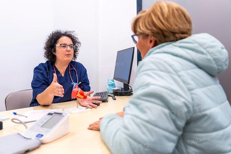 Female cardiologist doctor at the cardiology clinic talking to a client