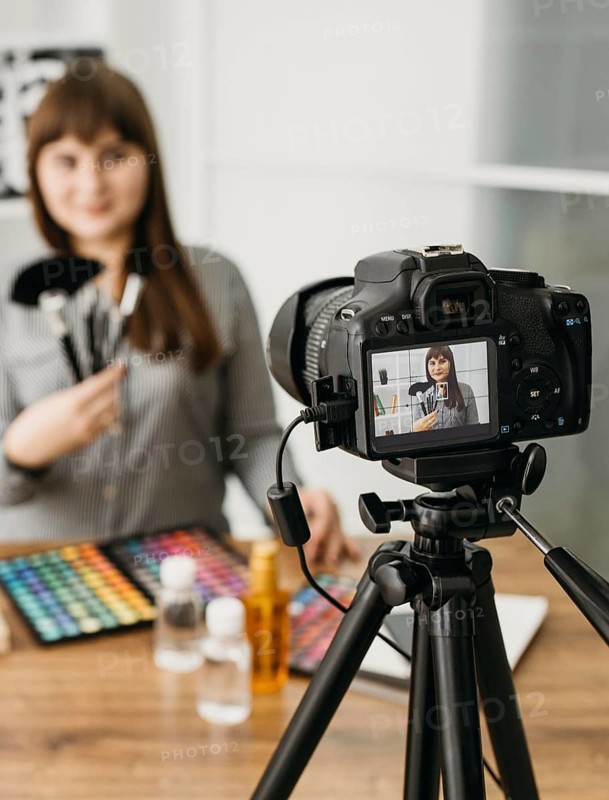 Female make up blogger with streaming with camera
