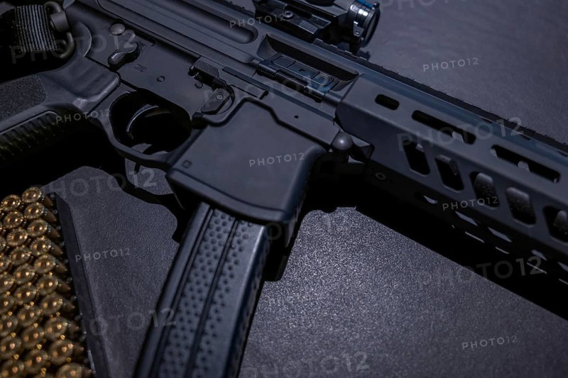 Modern Elegant Assault Rifle and Bullet on Grey Background in Switzerland