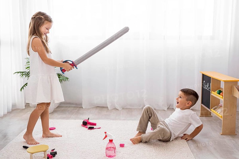 Kids playing with sword toys