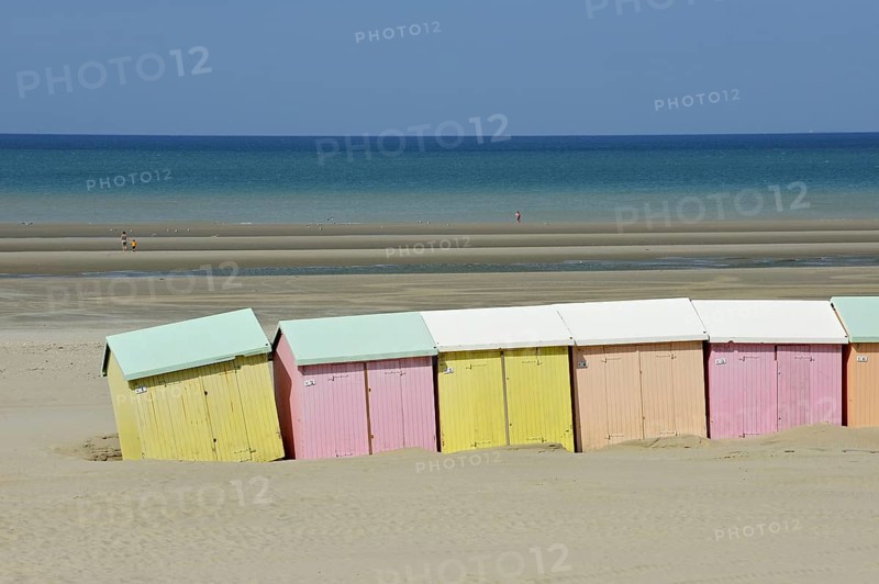 Row of colourful beach cabins in pastel colours along the North Sea at Berck