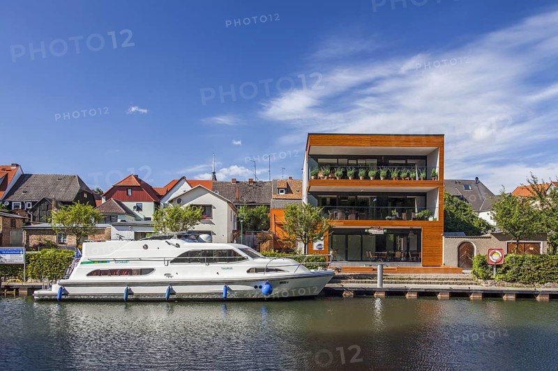 Pleasure boat in the Elde river moored at Plau am See