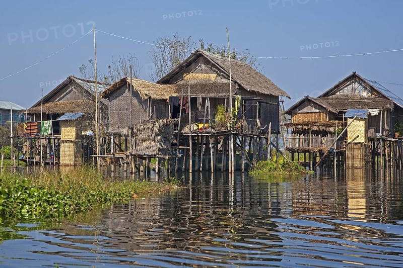 Intha lakeside village with traditional bamboo houses on stilts in Inle Lake