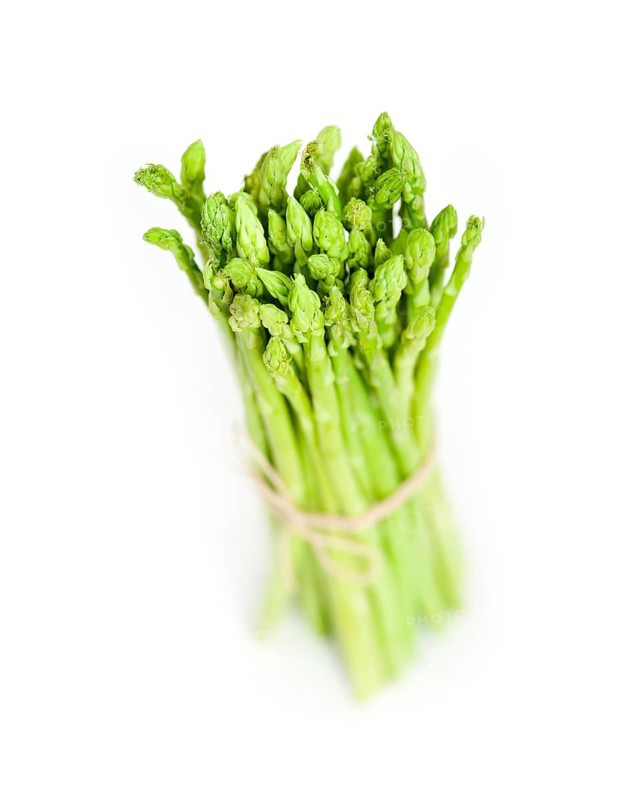 Fresh asparagus from the garden over white background