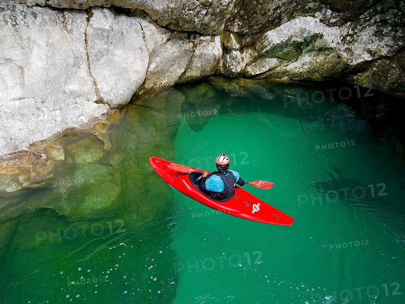 Kayakers on the emerald green Soca River