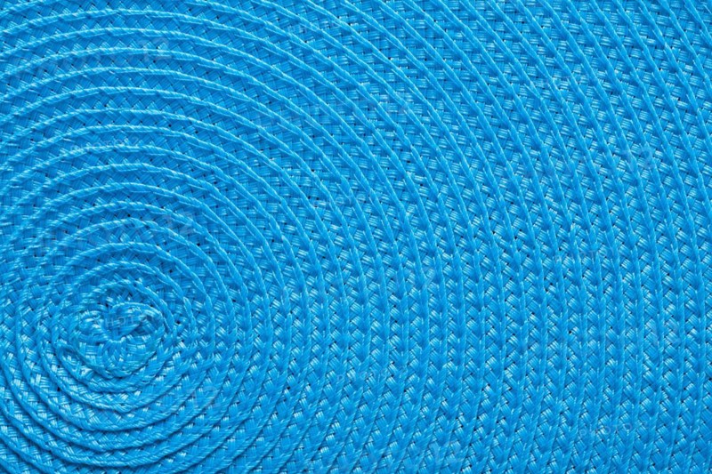 Close-up of the blue texture of a braided mat