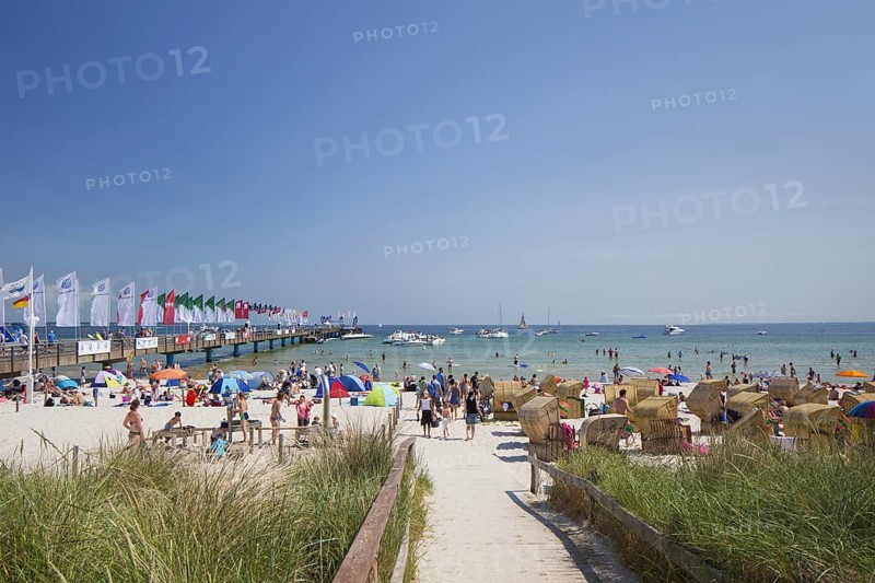 Roofed wicker beach chairs along the Baltic Sea at Scharbeutz