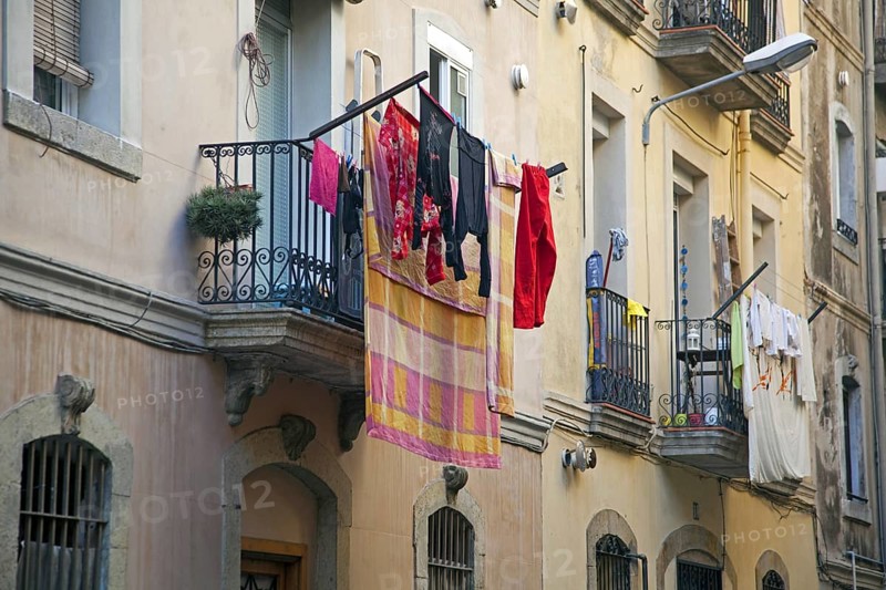 Laundry drying from balcony in the La Barceloneta quarter in Barcelona