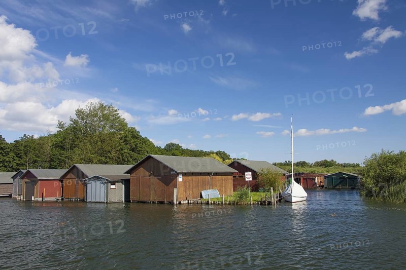 Wooden boat houses on the banks of the Plauer See at Plau am See
