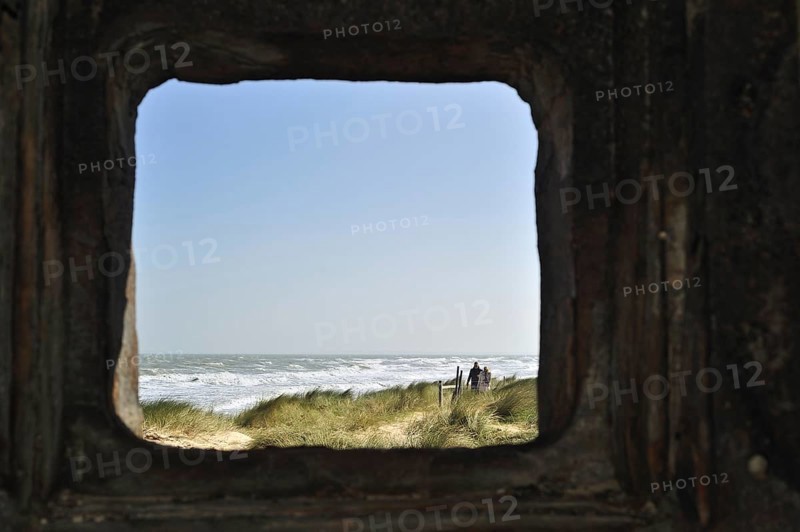 View over the sea through loophole in bunker at Utah Beach
