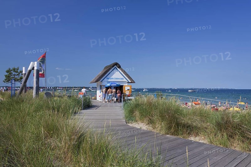 Cabin renting out roofed wicker beach chairs along the Baltic Sea at Scharbeutz
