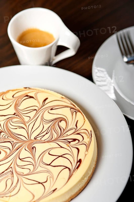 Fresh baked classic Cheese cake with chocolate topping and espresso coffee