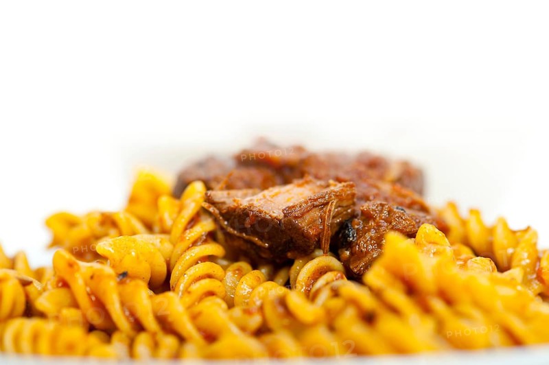 Fusilli pasta al dente with neapolitan style ragu meat sauce very different from bolognese style