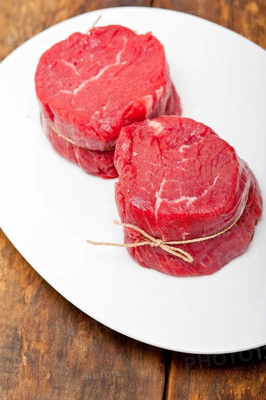 Fresh raw beef filet mignon cut ready to cook