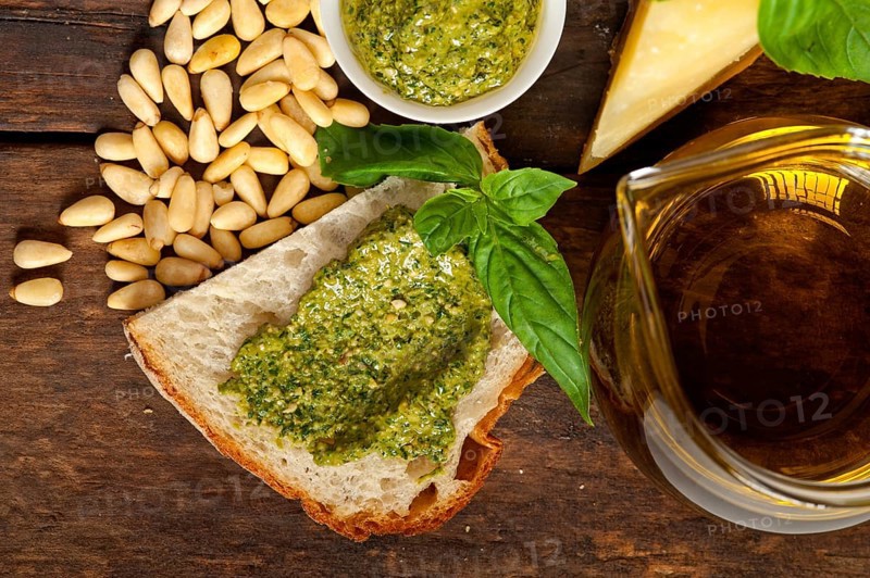 Italian basil pesto bruschetta ingredients over old wood macro