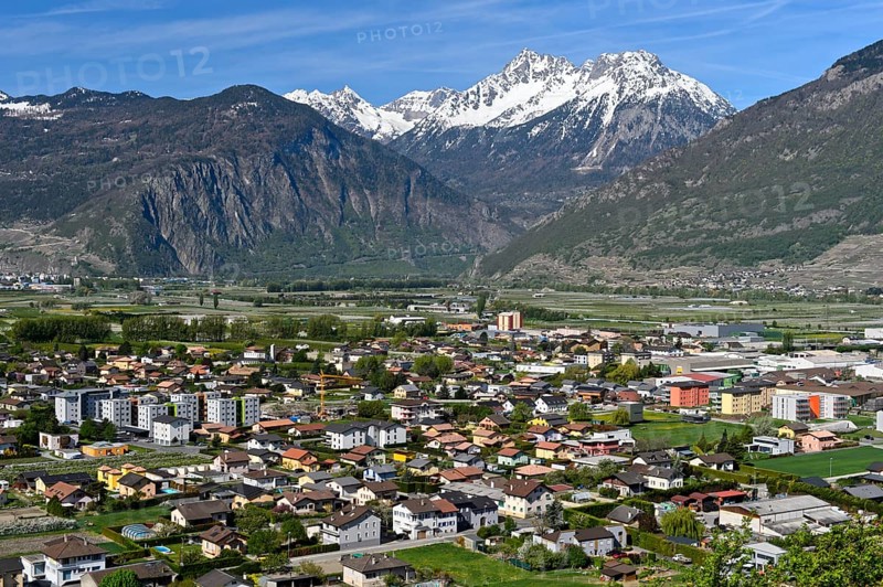 The village of Charrat in the wide Rhone valley in Lower Valais