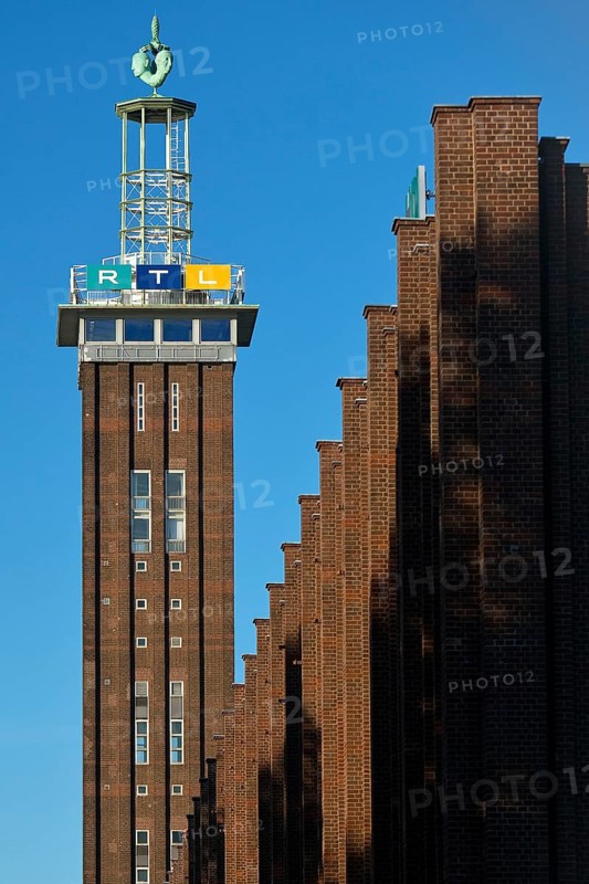 Trade fair tower with RTL logo and Hermes faces by Hans Wissel
