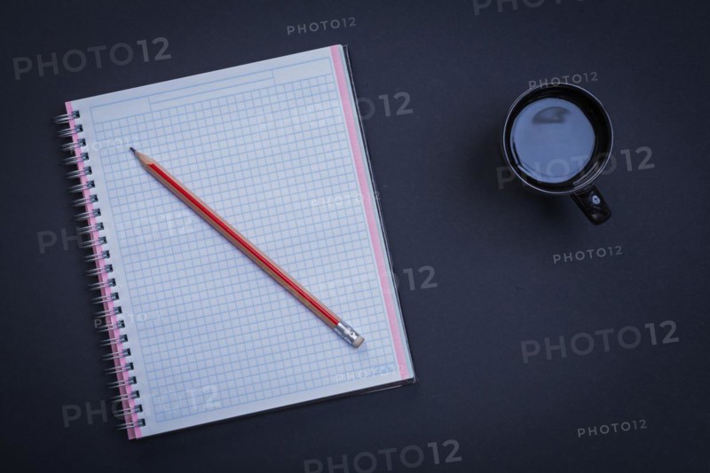 Clean square workbook pencil and cup of coffee on black background office concept