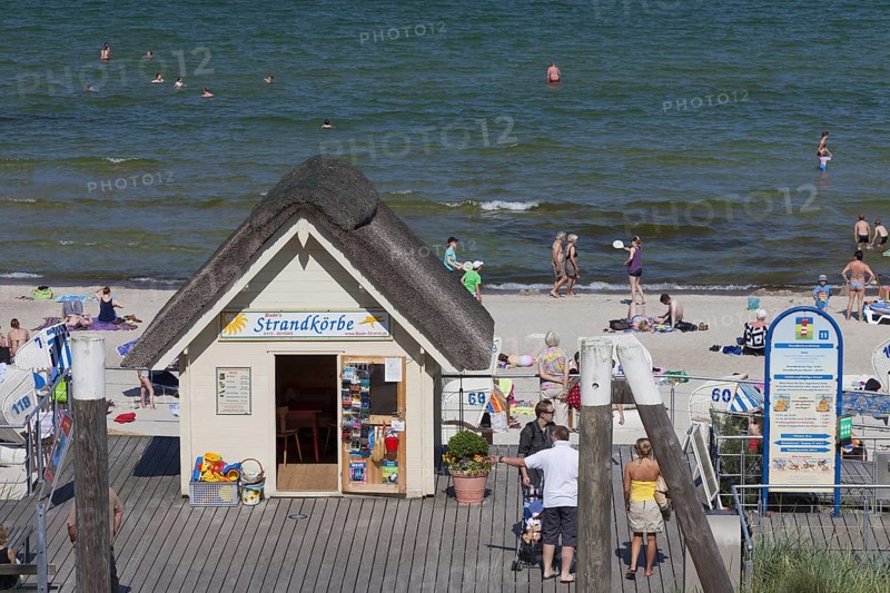 Cabin renting out roofed wicker beach chairs along the Baltic Sea at Scharbeutz