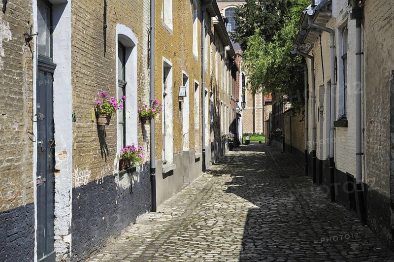 Narrow alleys with old houses of beguines in the beguinage of Lier