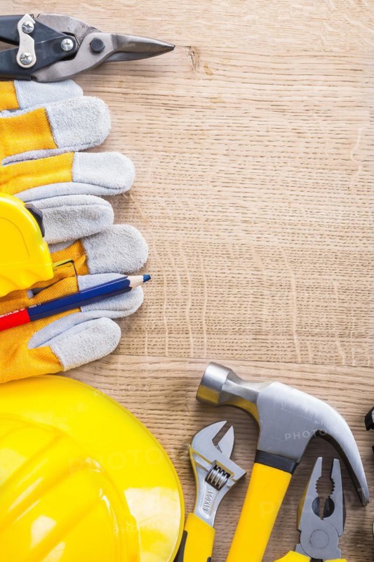 Vertical view of organised copy space with construction tools
