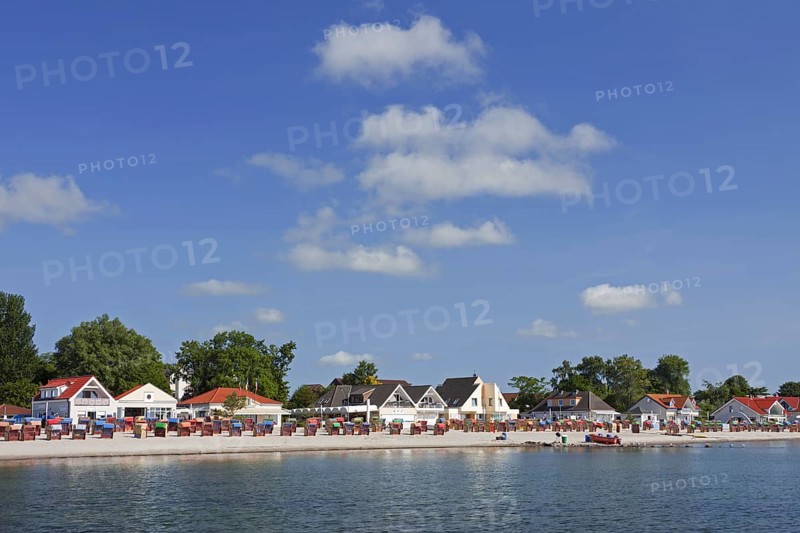 Roofed wicker beach chairs along the Baltic Sea at Kellenhusen