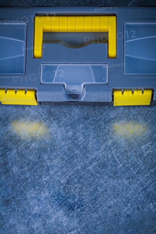 Copy space image of a closed tool set on a scratched metallic background Design concept
