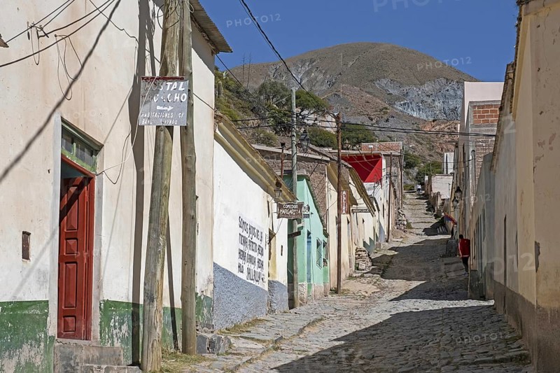Cobbled street with adobe houses and shops the village Iruya